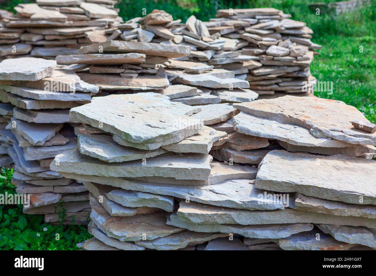Quarrystone in a pile . Stacked natural stones Stock Photo Alamy