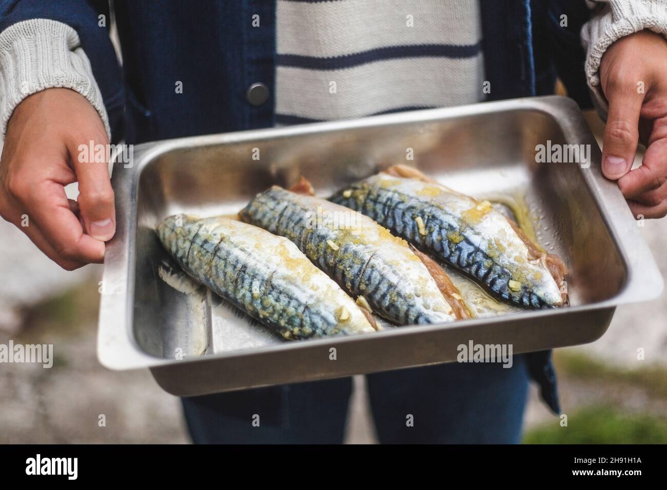 Midsection of man holding fish tray Stock Photo