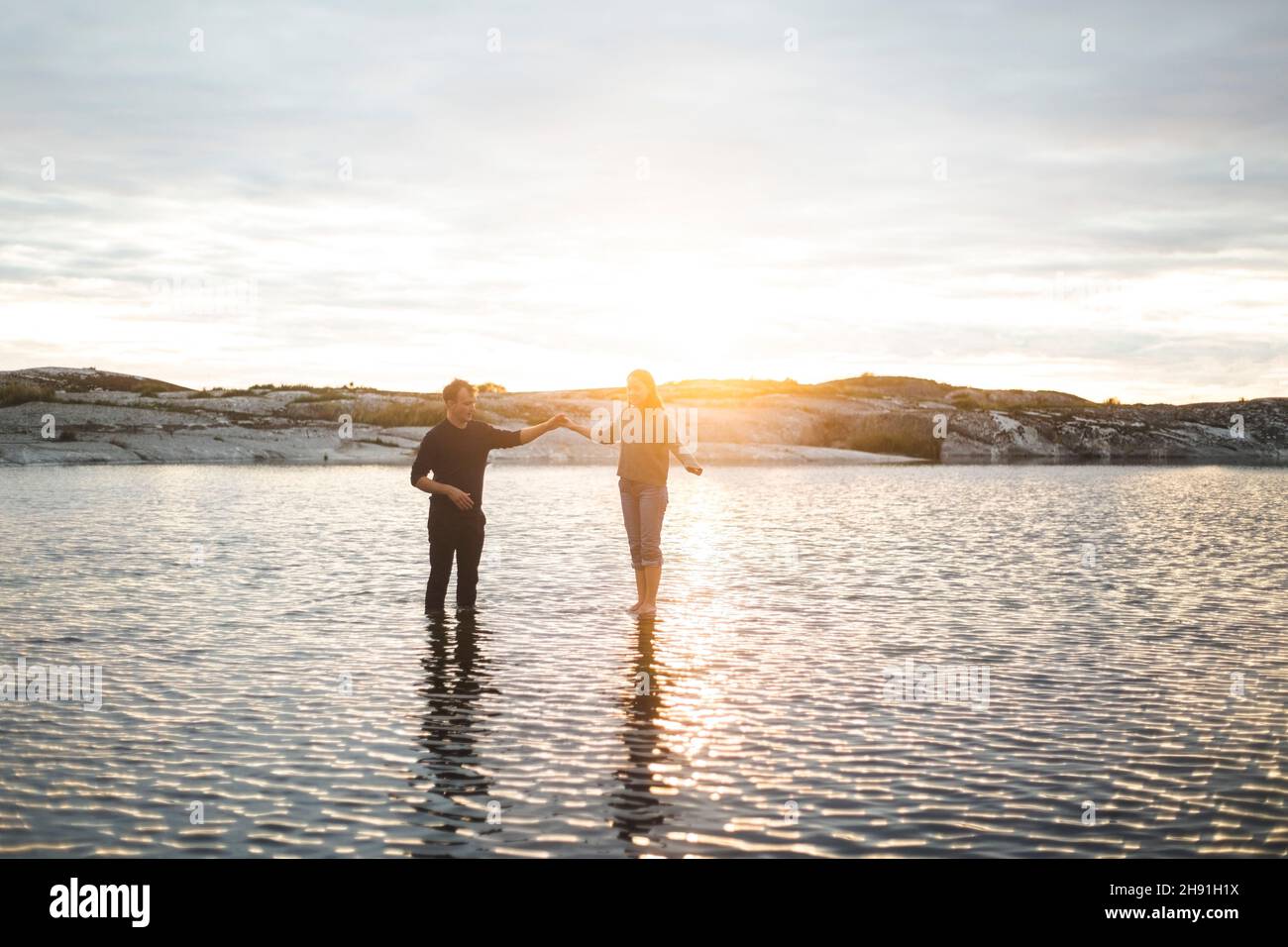 Heterosexual couple spending leisure time in sea during summer vacation Stock Photo