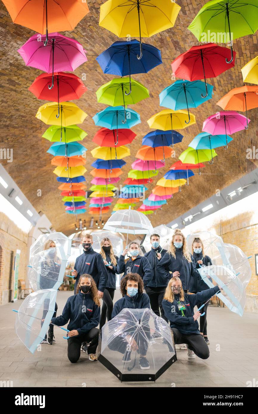 Dancers perform with umbrellas during a flash mob at London Bridge Station to mark International Day of Persons with Disabilities and help raise awareness of their situation in every aspect of life. Picture date: Friday December 3, 2021. Stock Photo