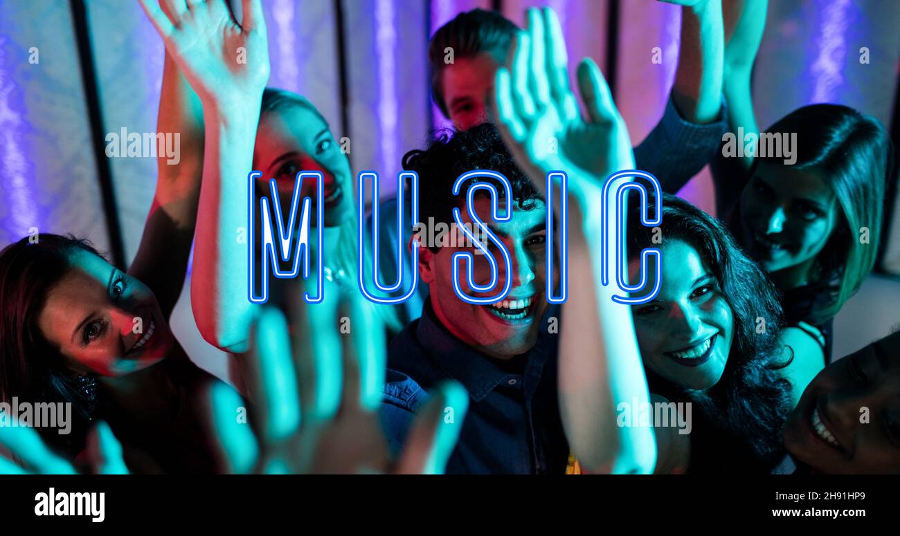 Composition of music text with male and female friends dancing in nightclub Stock Photo