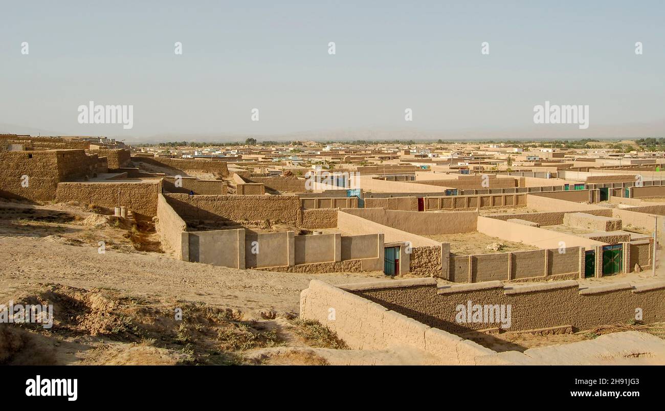 A relatively new informal settlement in the valley of Kabul Afghanistan with straight mud walls and clean streets resembling a modern urban area with Stock Photo