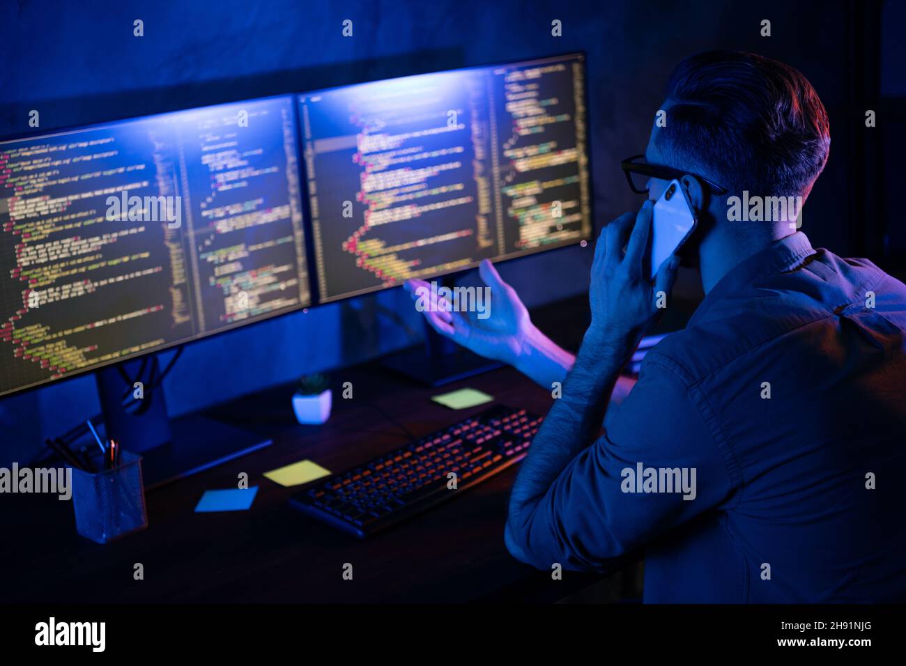 Rear portrait of busy developer speak telephone coworking start-up ...