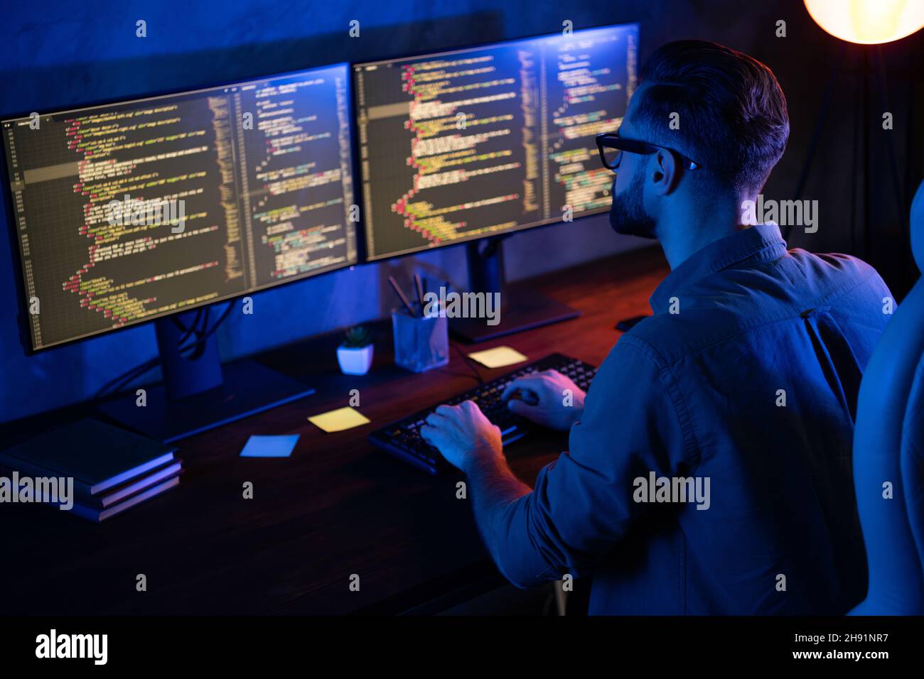 Rear photo of smart skilled introvert tester write typing operating