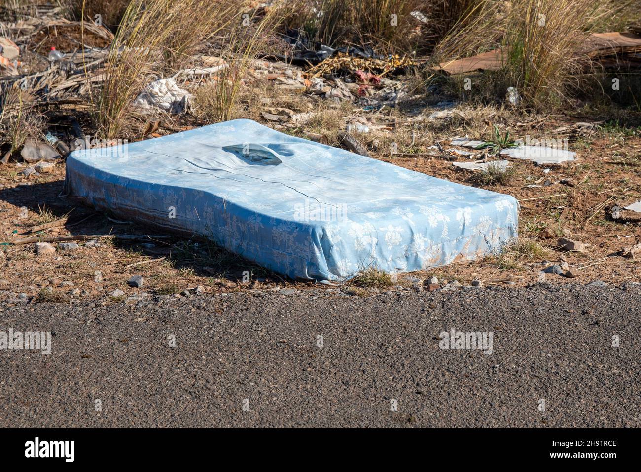 Mattress on the side of the road wild garbage dump Stock Photo Alamy