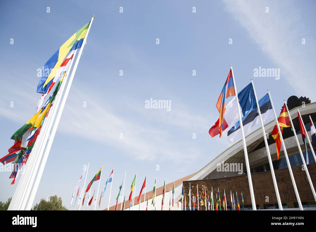 Flags of different countries against the blue sky Stock Photo - Alamy