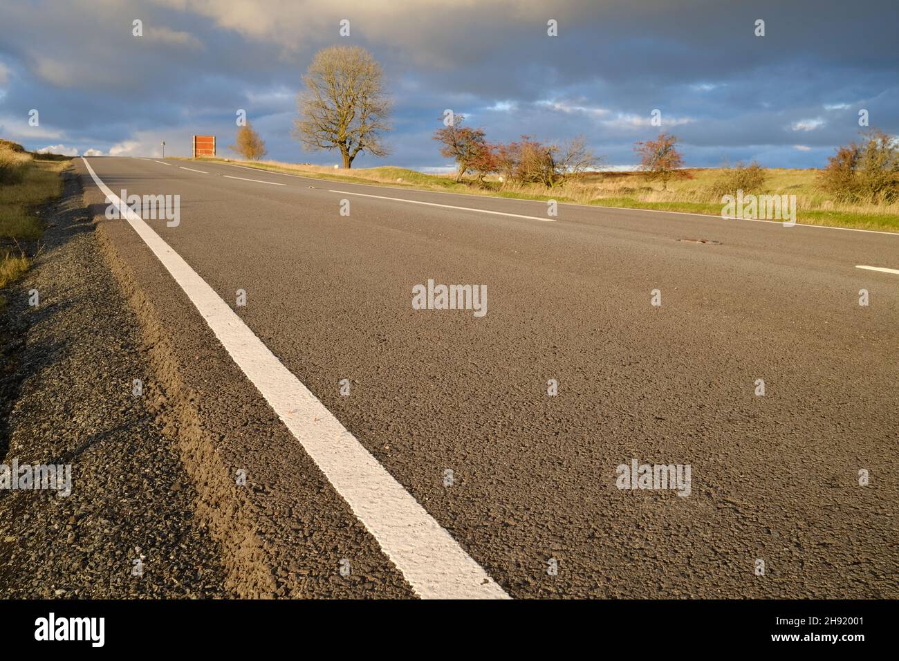 low-angle view of a remote country road Stock Photo
