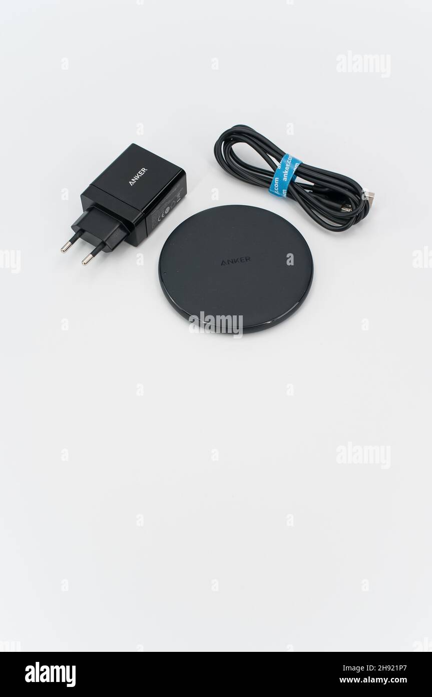 wireless smartphone charger on a white tabletop background Stock Photo