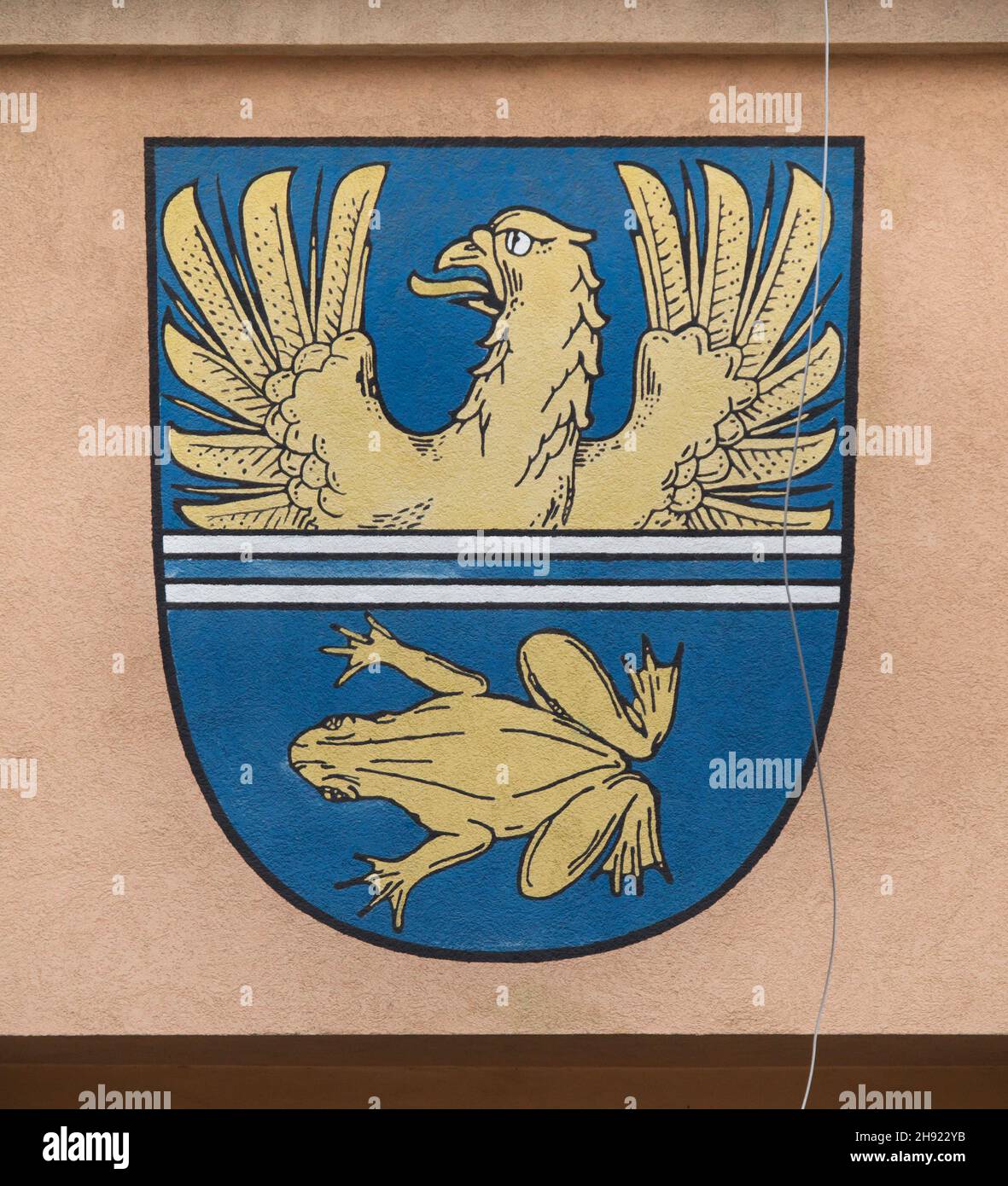 Coat of arms of the village of Tršice depicted on the building of the municipality council in Tršice near Olomouc in North Moravia, Czech Republic. Stock Photo