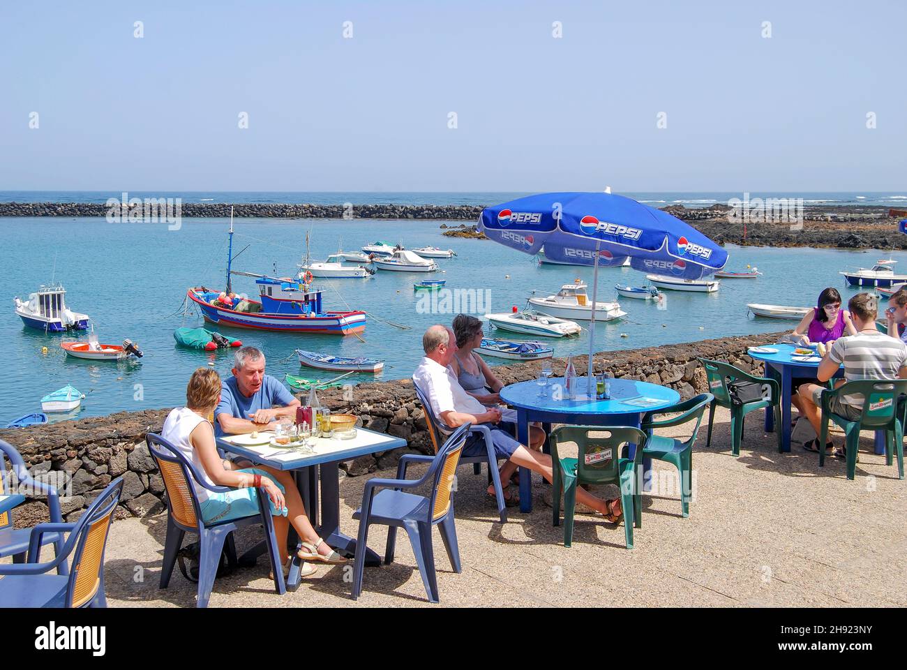 Harbour terrace restaurant, Orzola, Province of Las Palmas, Lanzarote, Canary Islands, Spain Stock Photo