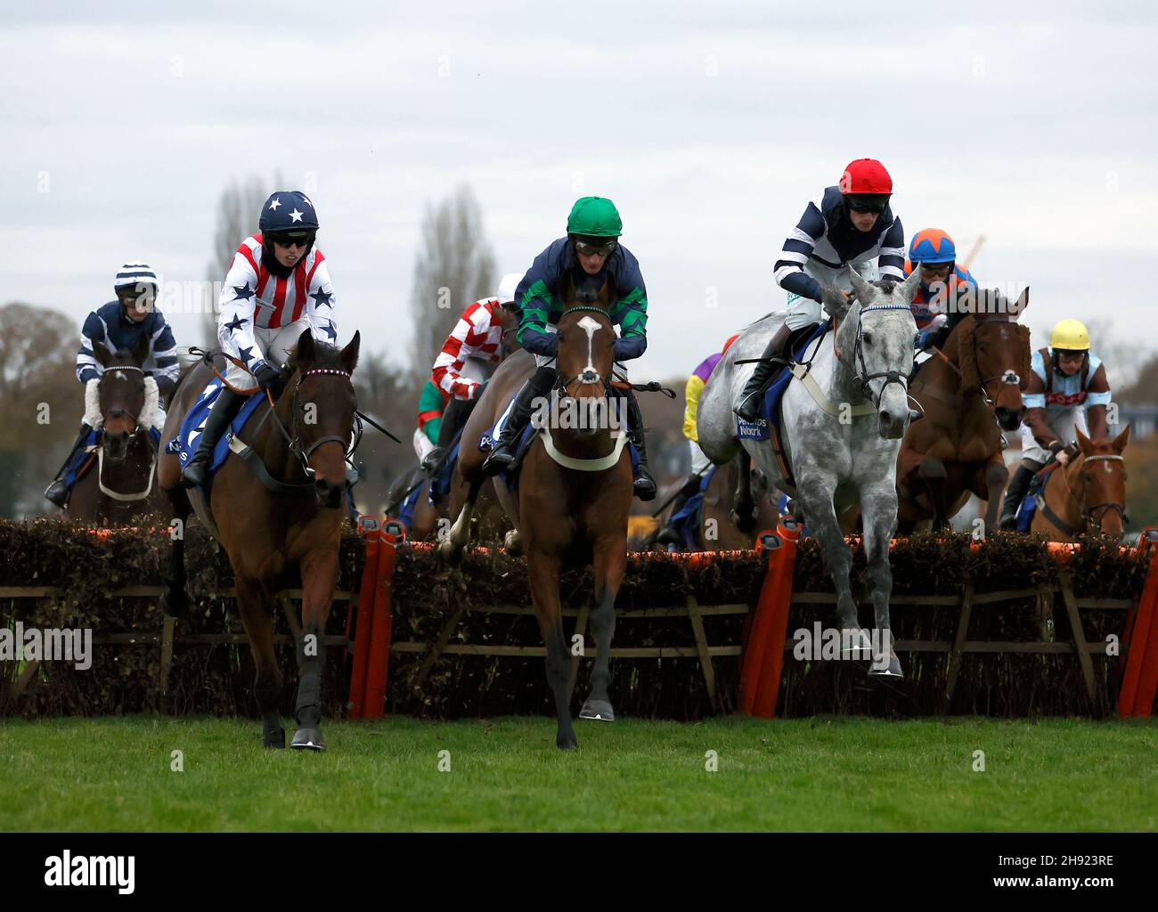 Charlie Hammond riding South Terrace, Daryl Jacob riding The Cob and Thomas Doggrell riding Al Dancer in the Pertemps Network Handicap Hurdle during the Betfair Tingle Creek Festival at Sandown Park Racecourse, Esher. Picture date: Friday December 3, 2021. Stock Photo