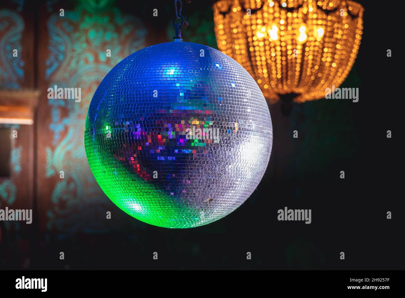 Disco ball and chandelier in a night club Stock Photo - Alamy