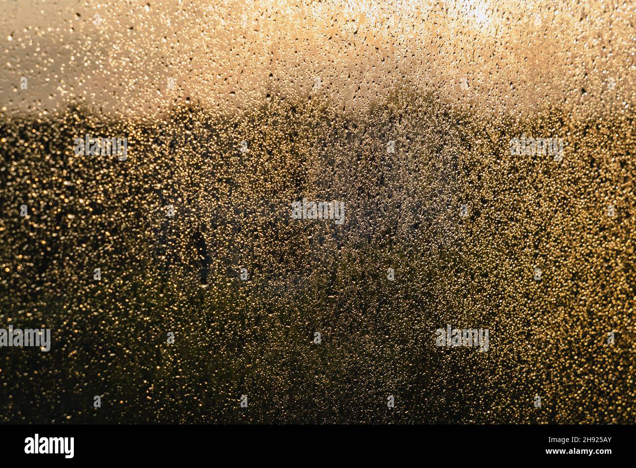 Close up on a raindrops on a balcony pane Stock Photo