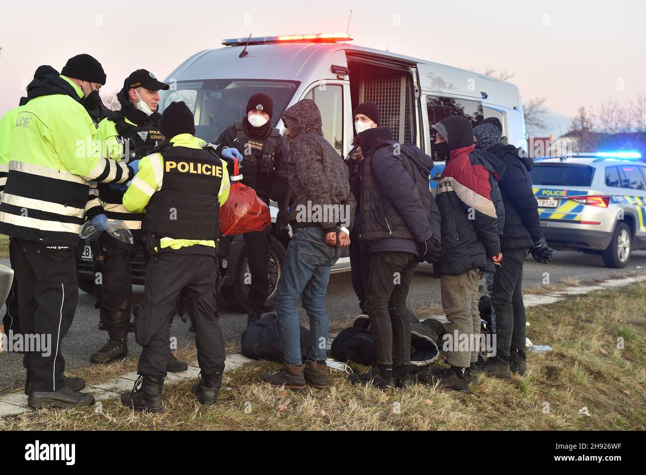 Lanzhot, Czech Republic. 03rd Dec, 2021. The south Moravian police detained 26 migrants in two separate cases in Czechia's southernmost Breclav district, Czech Republic, December 3, 2021, the first vehicle, a VW Sharan, being stopped for a road check and the other, a Chrysler Voyager, halted by a patrol in a civilian car after a several-minute pursuit. Credit: Vaclav Salek/CTK Photo/Alamy Live News Stock Photo