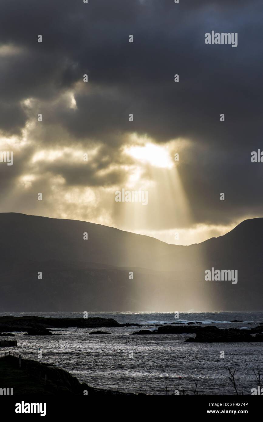 Sunbeams burst through cloud during a gathering storm on Wild Atlantic Way at Rosbeg, County Donegal, Ireland Stock Photo