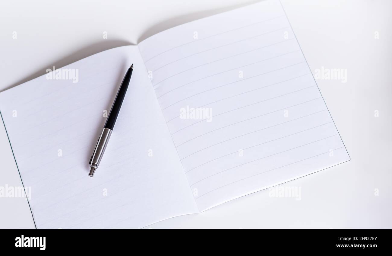 blank white booklet with pen on white background Stock Photo