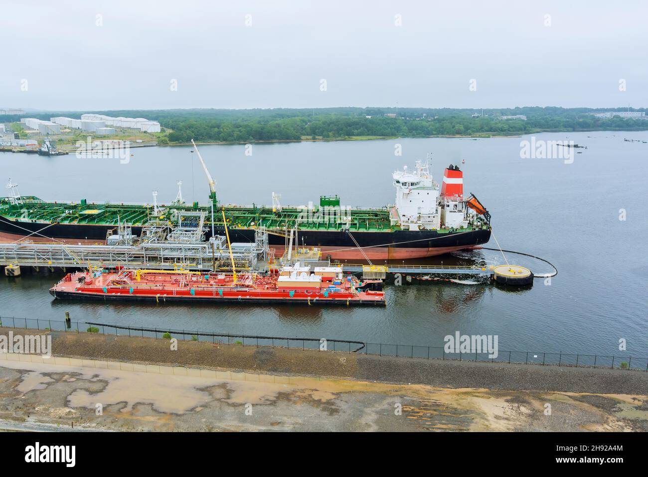 Aerial view cargo operations tanker ship, oil ship operation during petroleum transfer Stock Photo