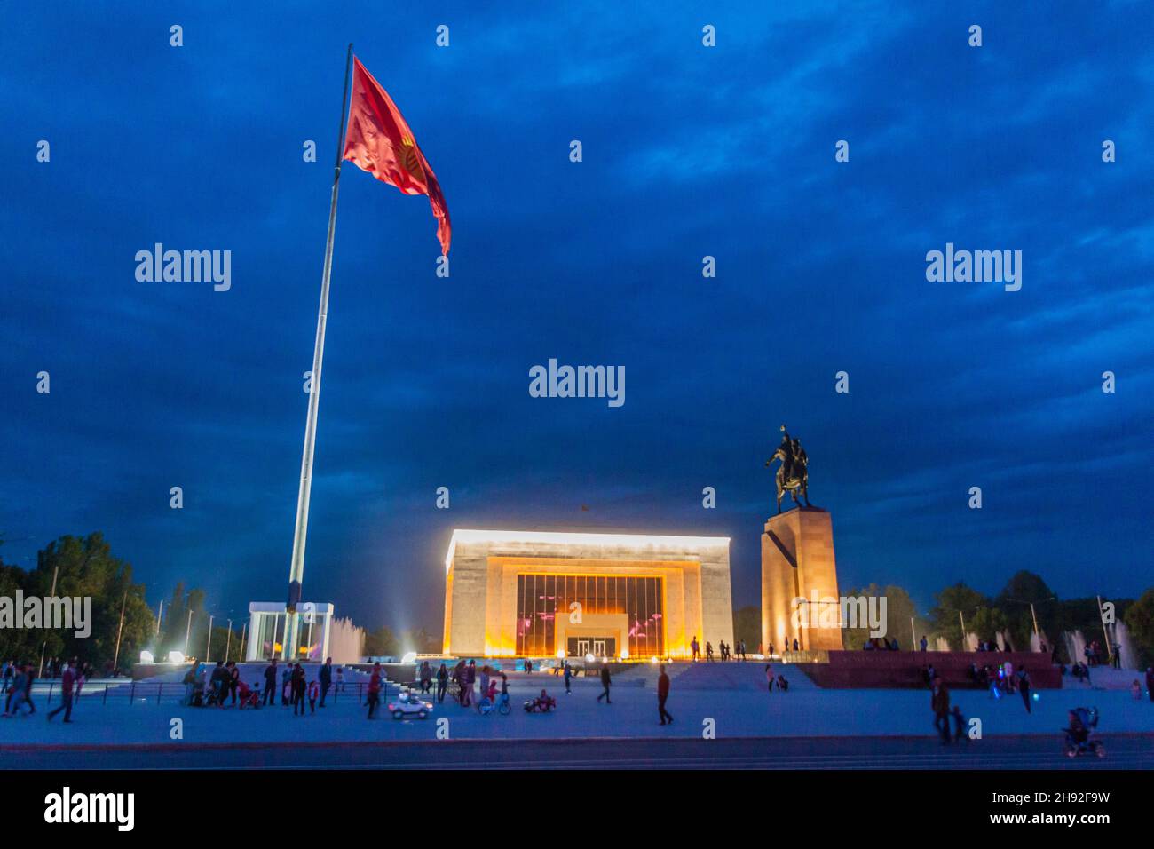 BISHKEK, KYRGYZSTAN - MAY 6, 2017: Flag pole, Manas statue and State History Museum at Ala Too square in Bishkek, capital of Kyrgyzstan. Stock Photo