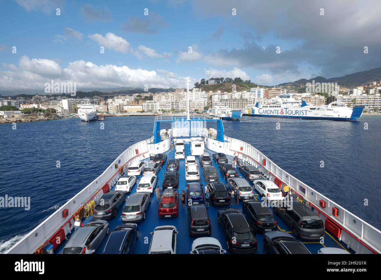 On the ferry with cars and camper vans to Sicily crossing Straits of Messina, Italy, Sicily Stock Photo