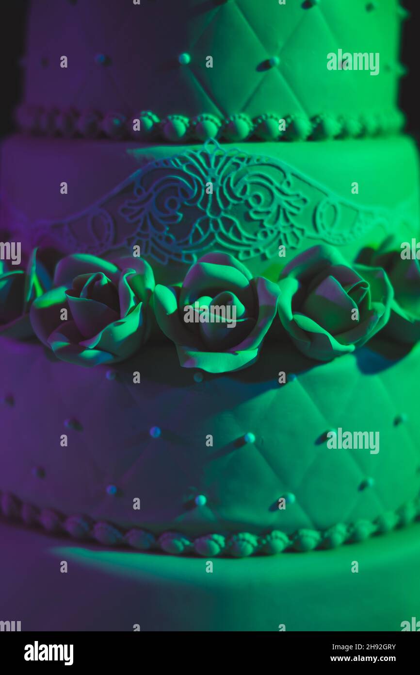 A beautiful brown threetiered wedding cake with roses. Tasty looking