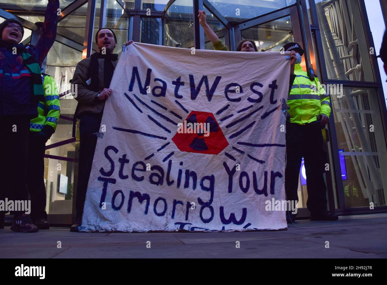 London, UK. 3rd December 2021. Protesters outside NatWest head office in Bishopsgate. University staff and members of the University and College Union (UCU) have taken strike action and marched through Central London in protest over gender, ethnic and disability pay inequality, work conditions, and falling pay. Credit: Vuk Valcic / Alamy Live News Stock Photo