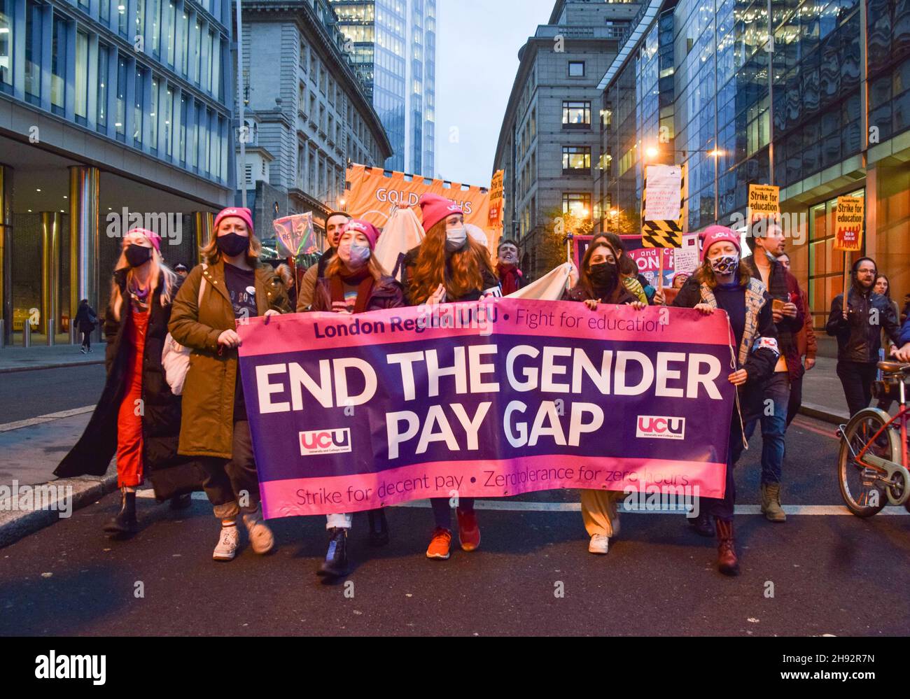 London, UK. 3rd December 2021. Protesters in the City of London. University staff and members of the University and College Union (UCU) have taken strike action and marched through Central London in protest over gender, ethnic and disability pay inequality, work conditions, and falling pay. Credit: Vuk Valcic / Alamy Live News Stock Photo