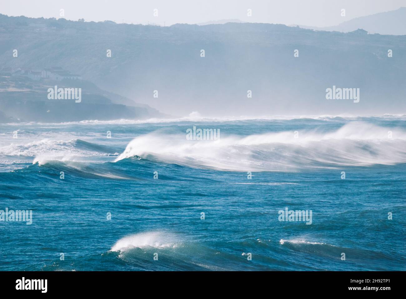 Big breaking Ocean waves hit the coastline. Strong wave Stock Photo
