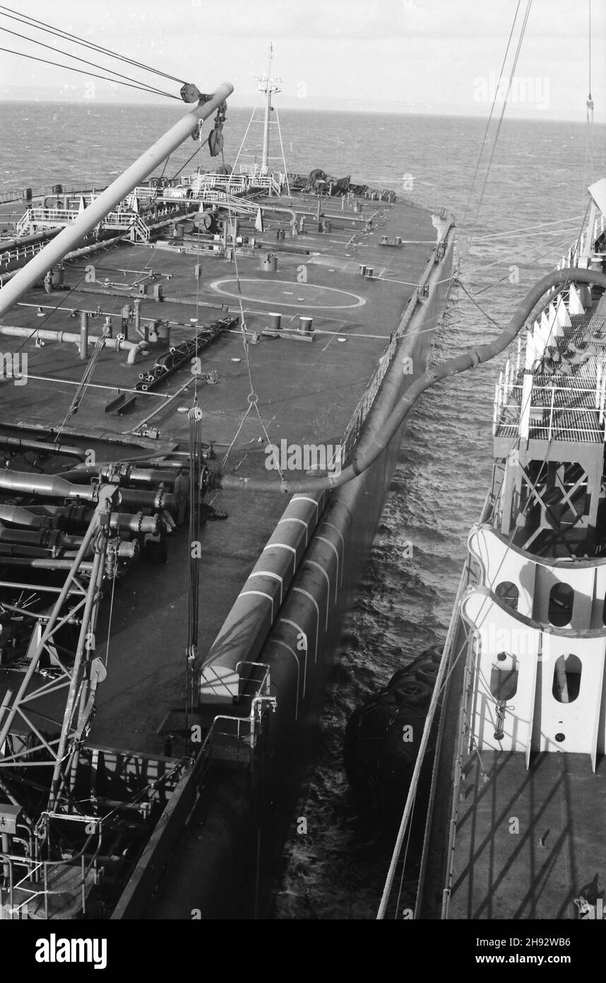 SS Esso York (right) lightening supertanker in Lyme Bay, southern England. An operation to remove some of the larger ship's cargo so that it could access ports where it couldn't go fully loaded. Photo taken 1975/76 Stock Photo