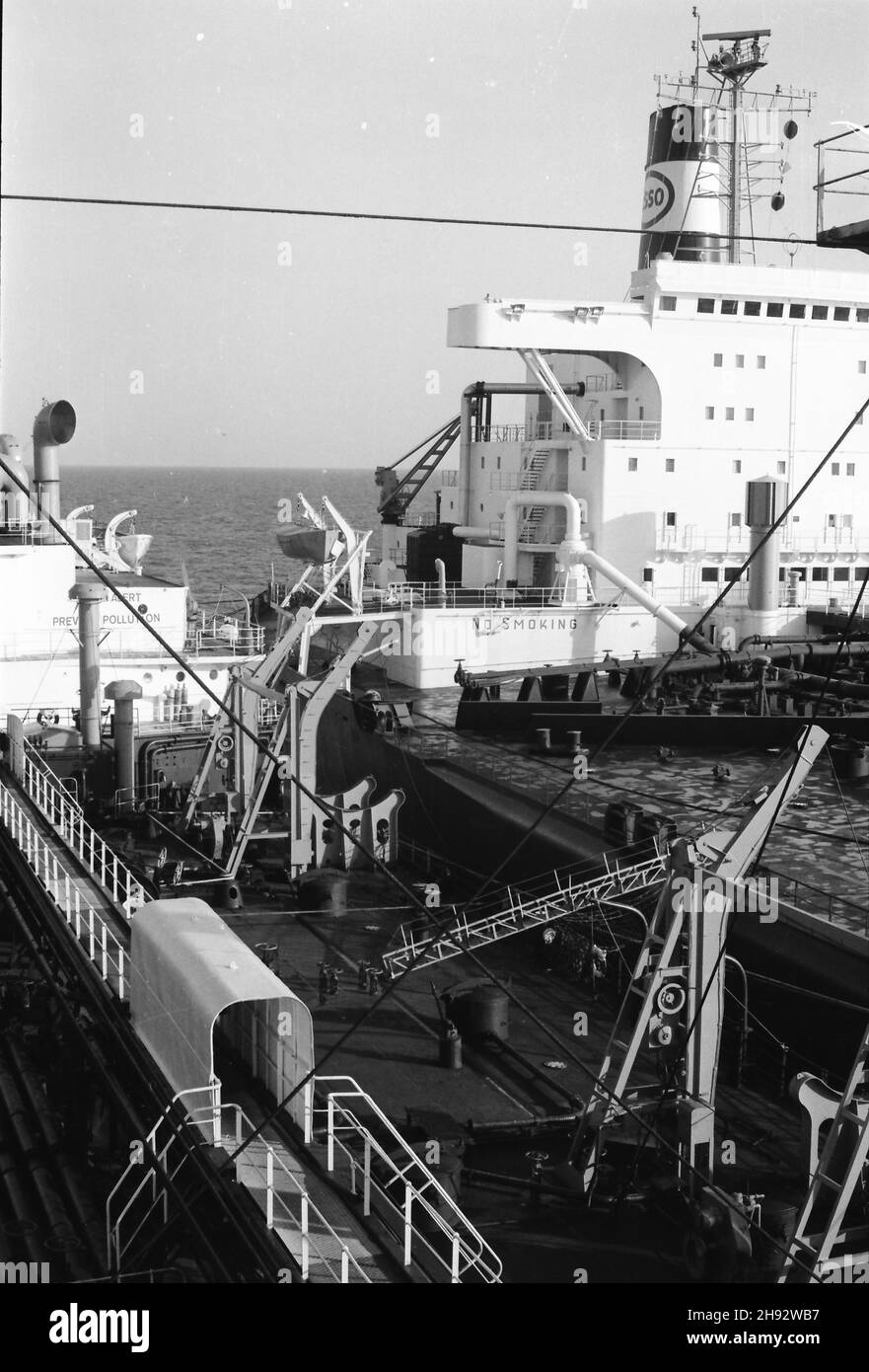 SS Esso York (left) lightening supertanker in Lyme Bay, southern England. An operation to remove some of the larger ship's cargo so that it could access ports where it couldn't go fully loaded. Photo taken 1975/76 Stock Photo