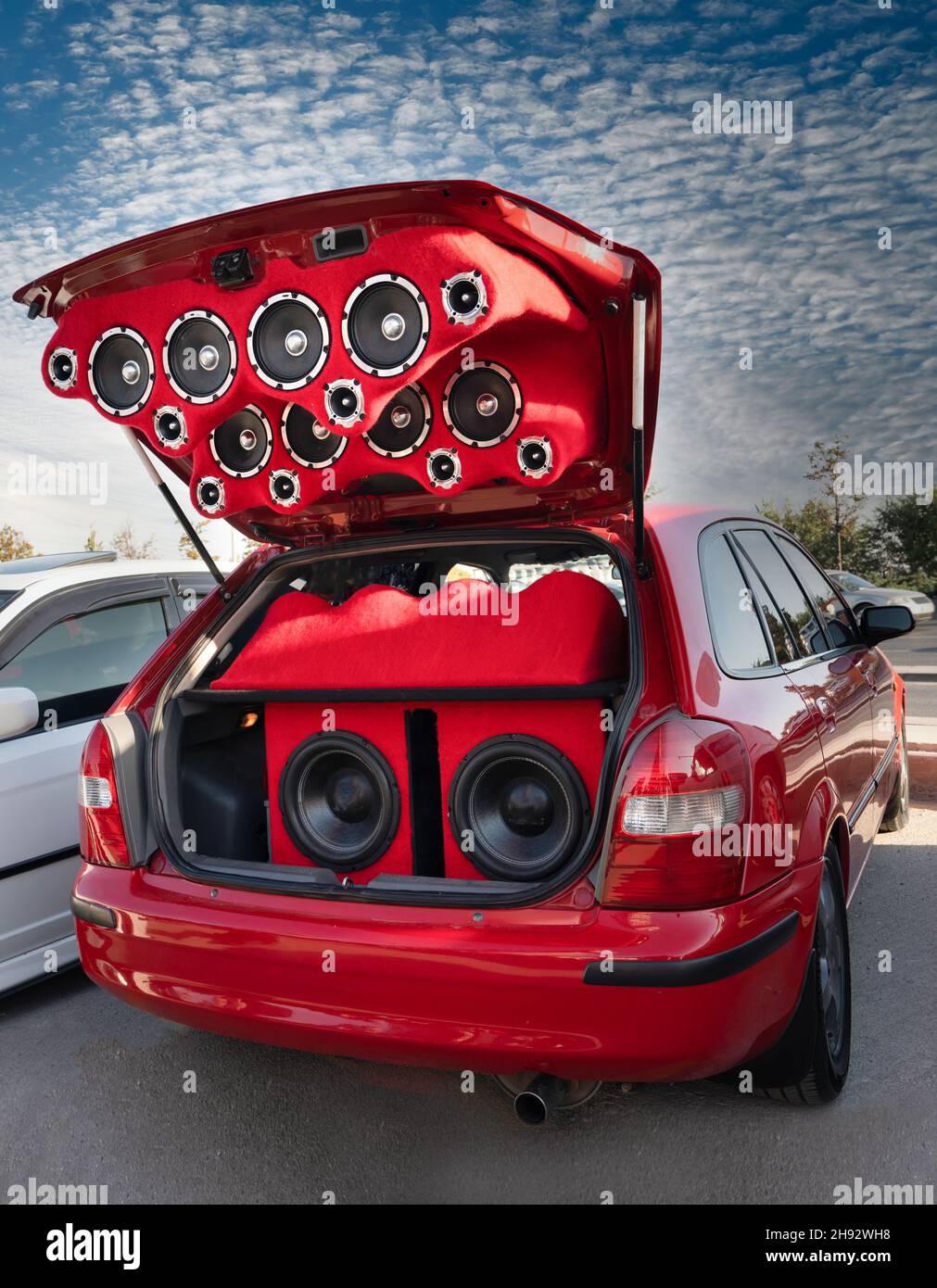 Sound system consisting of many speakers installed in the rear trunk of