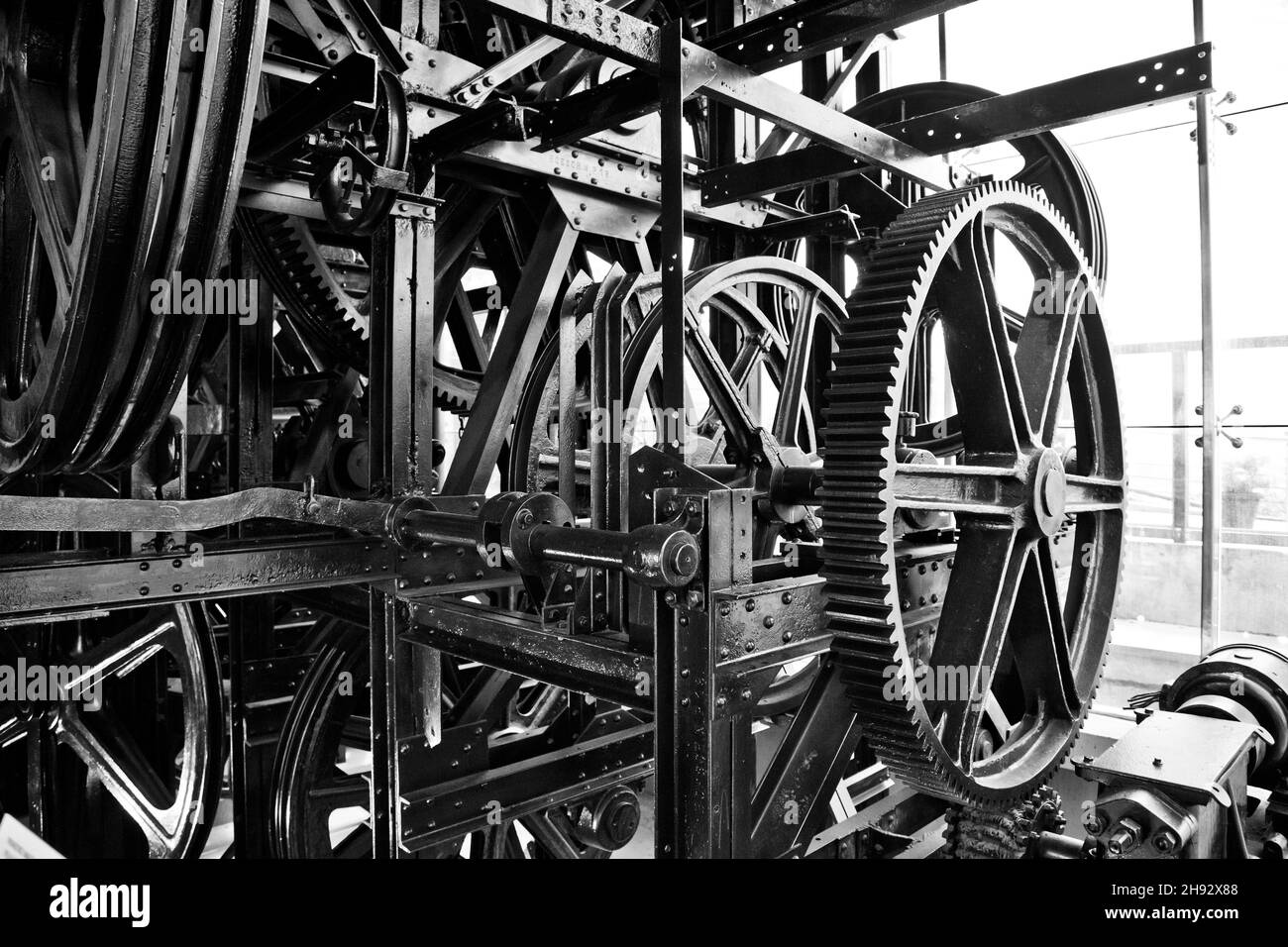 Grayscale shot of machines in a factory Stock Photo