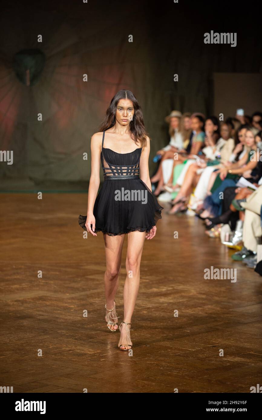 A model walks the runway at the Spring / Summer 2022, AADNEVIK Fashion Show during the London Fashion Week at the The Royal Horseguards. Stock Photo