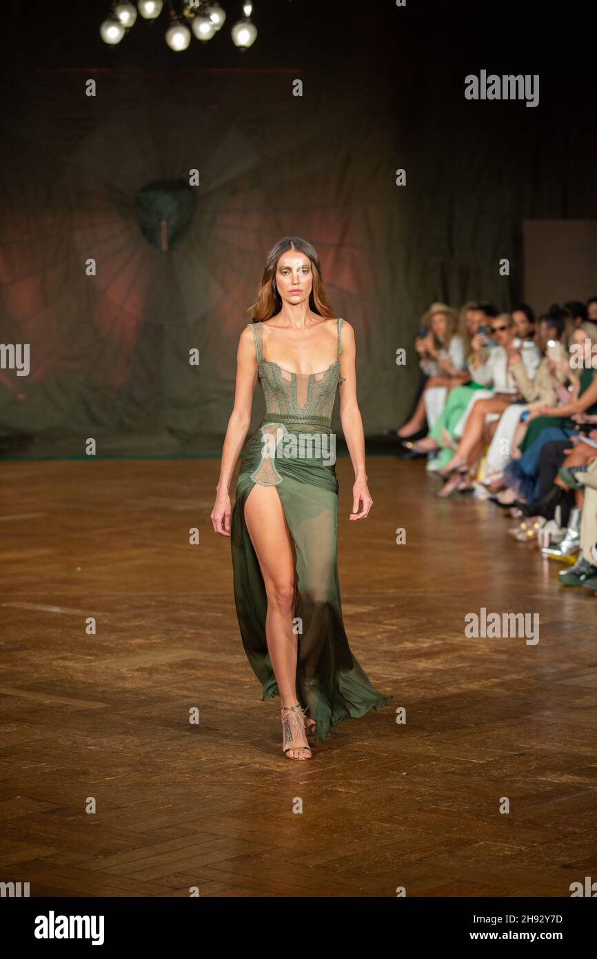 A model walks the runway at the Spring / Summer 2022, AADNEVIK Fashion Show during the London Fashion Week at the The Royal Horseguards. Stock Photo