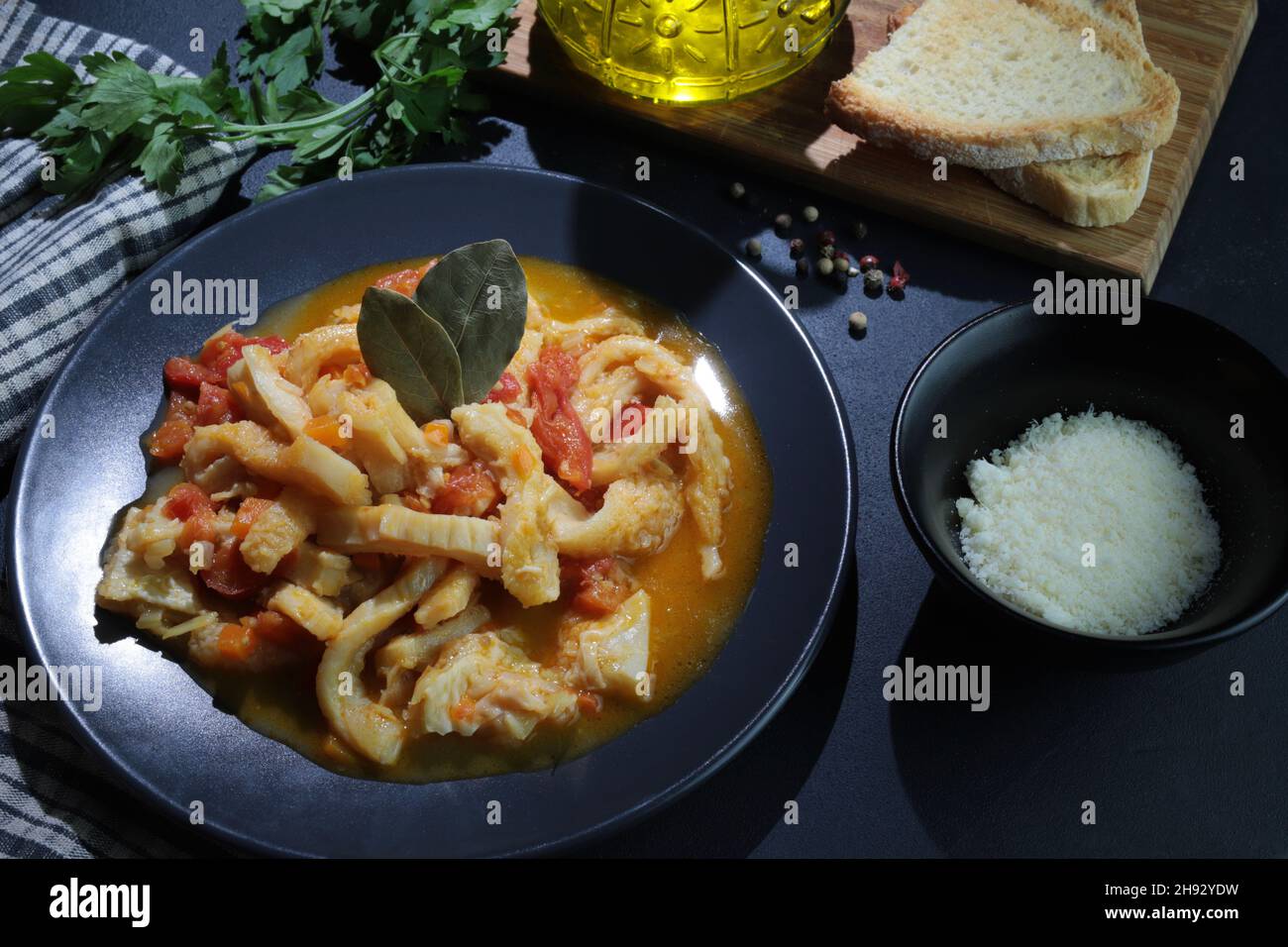 Italian food. Dish of typical beef tripe with tomato sauce with bread