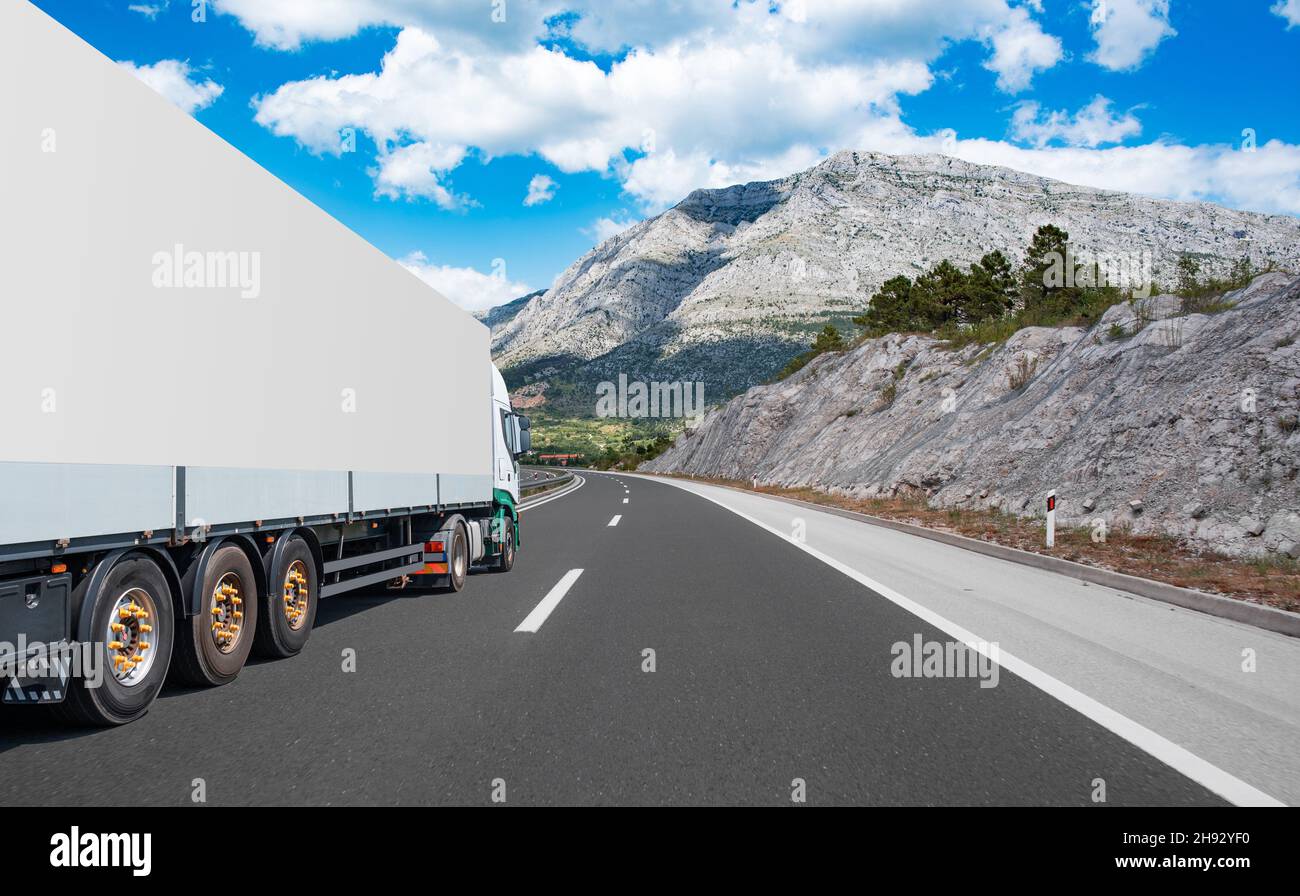 White truck on asphalt road Stock Photo - Alamy