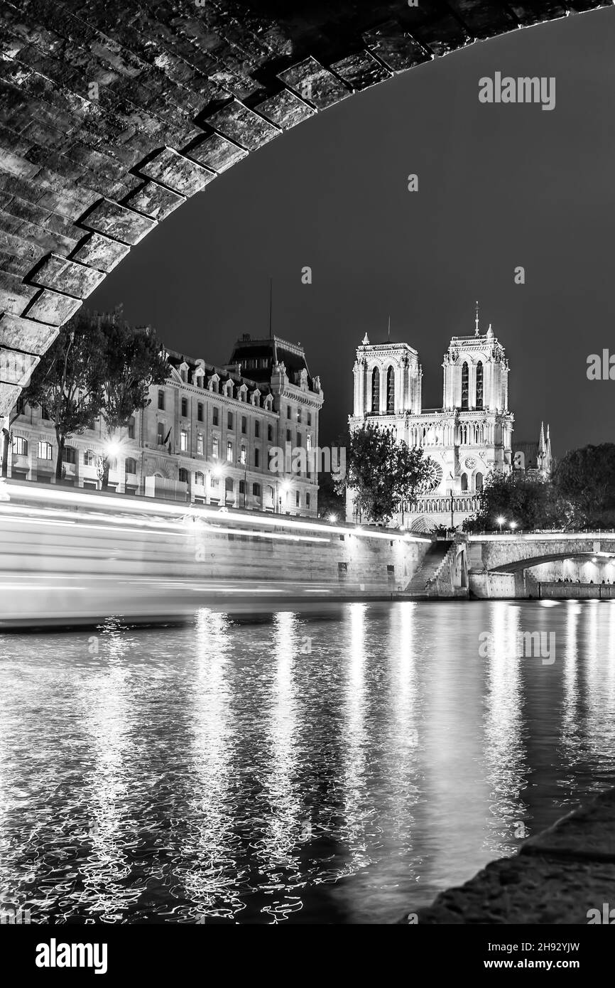 The Seine river and Notre Dame de Paris at night, France. Black and white photography Stock Photo