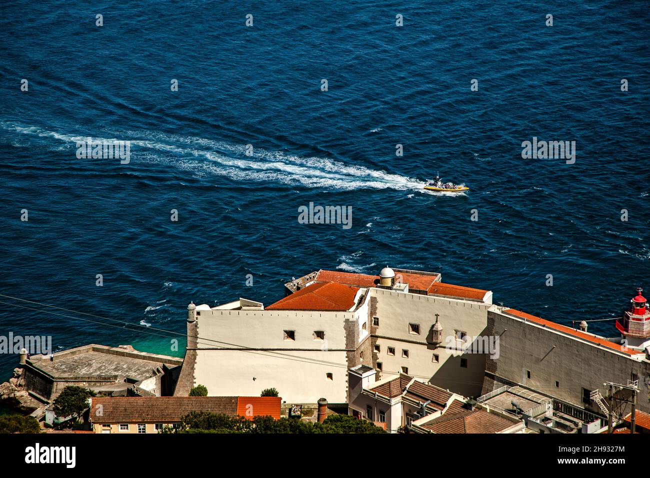 Aerial view of a motor ship on the sea with the view of the coastal ...