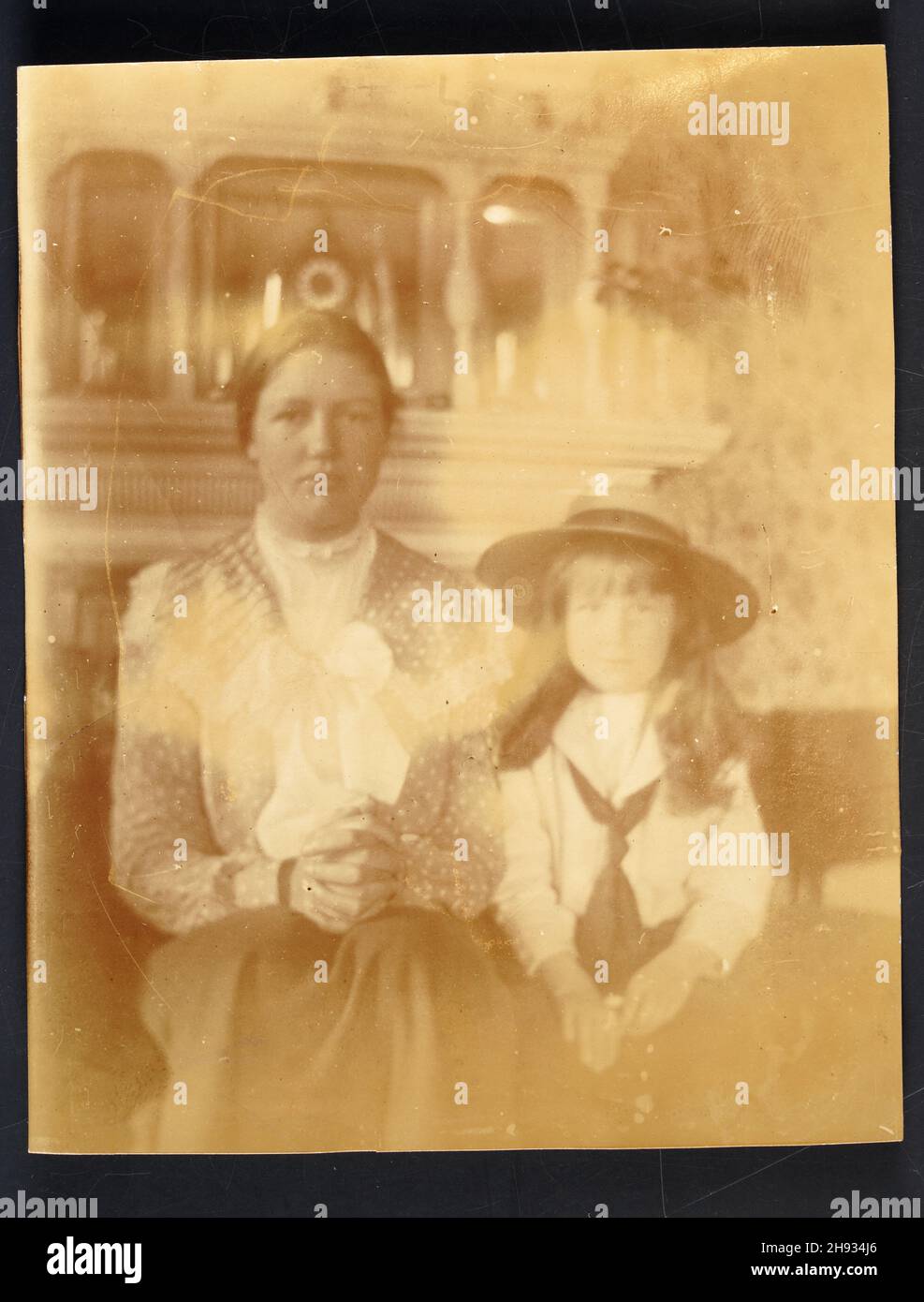 Vintage faded photograph of a mother and daughter, English, anonymous, 1910s Stock Photo