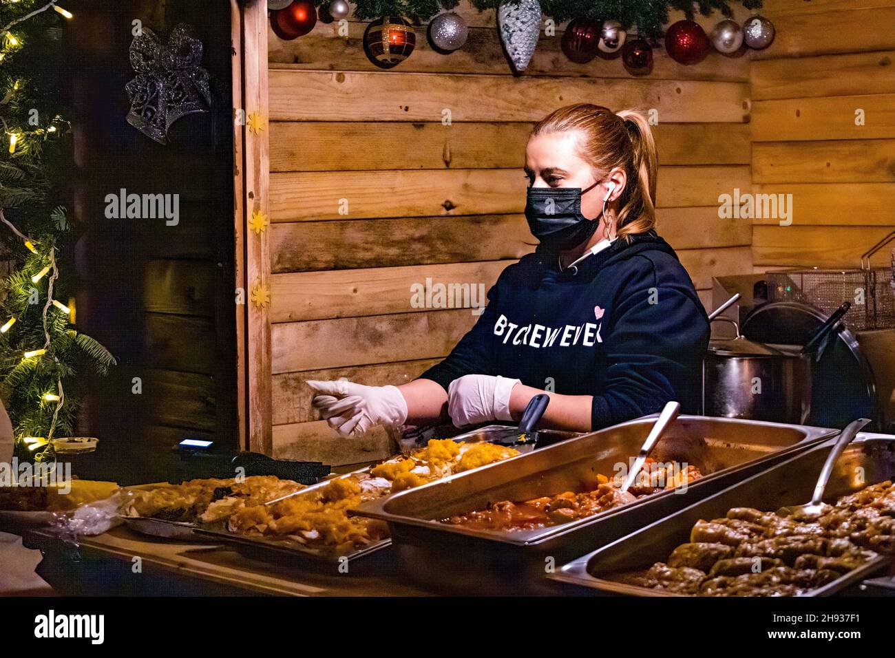 Bucharest, Romania. 3rd Dec. 2021. Woman selling traditional romanian food Stock Photo