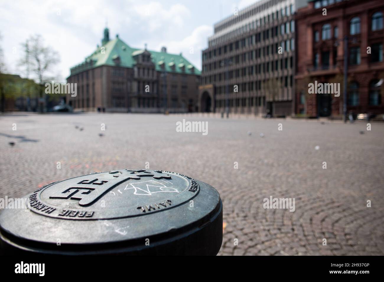 Closeup of the key of Bremen as a symbol for free market rights and the historic town hall (unesco world cultural heritage) in the background Stock Photo