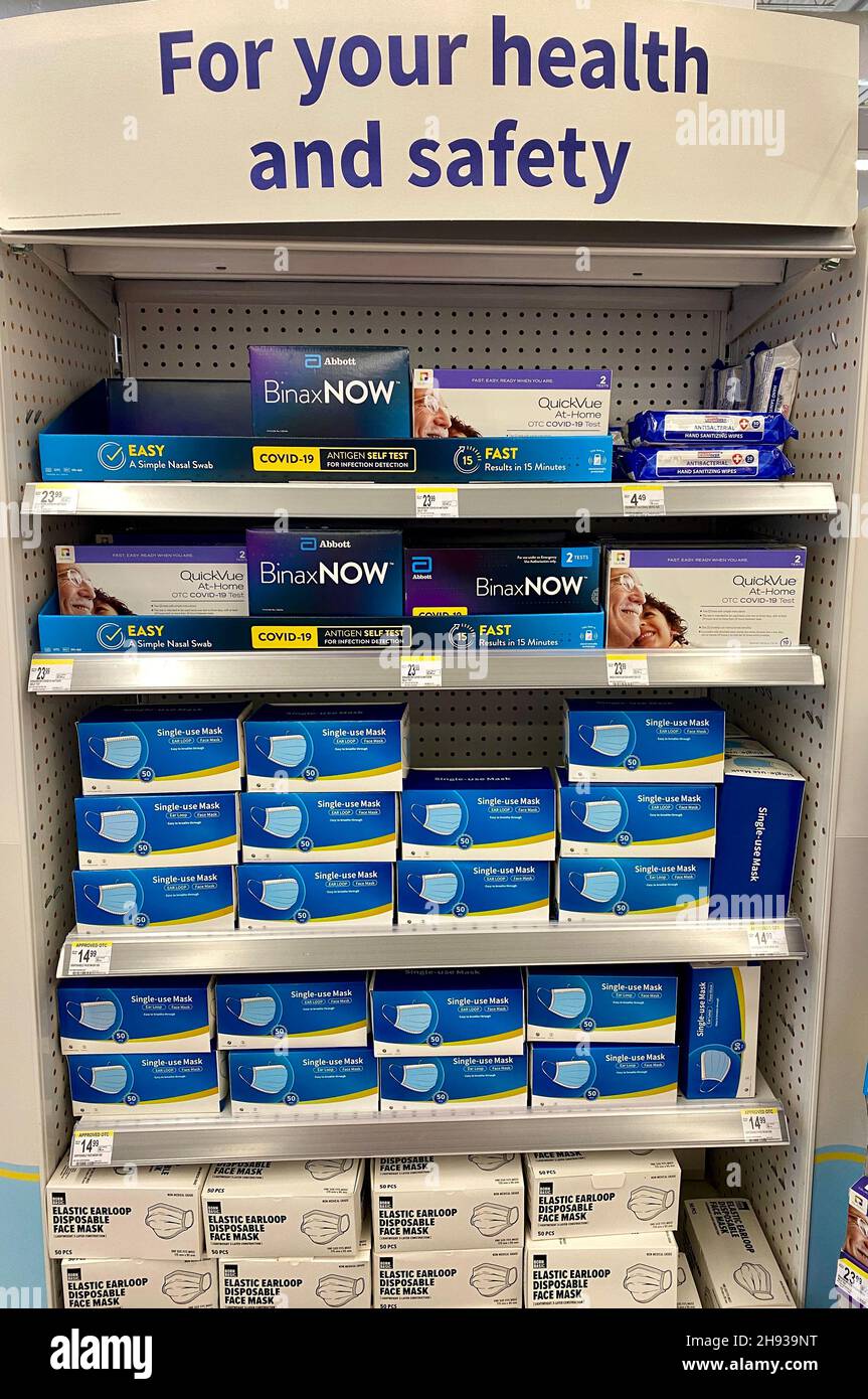 COVID19 antigen selftest kits and protective face masks on display at a Walgreens store after