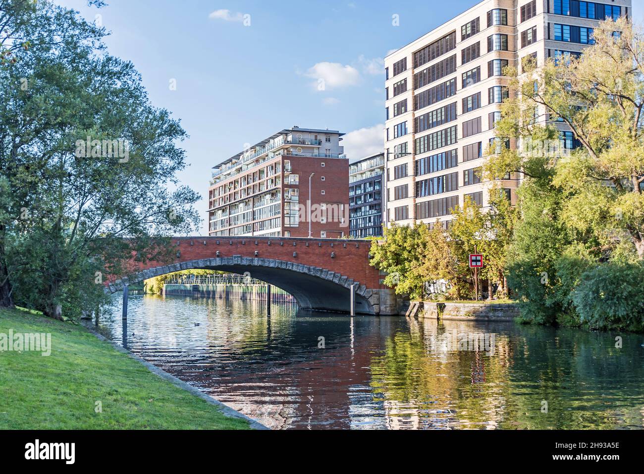 Berlin, Germany - October 7, 2021: Banks of the Landwehr Canal Salzufer and Einsteinufer with the road bridge Dovebruecke, built in 1910-1911 and a li Stock Photo