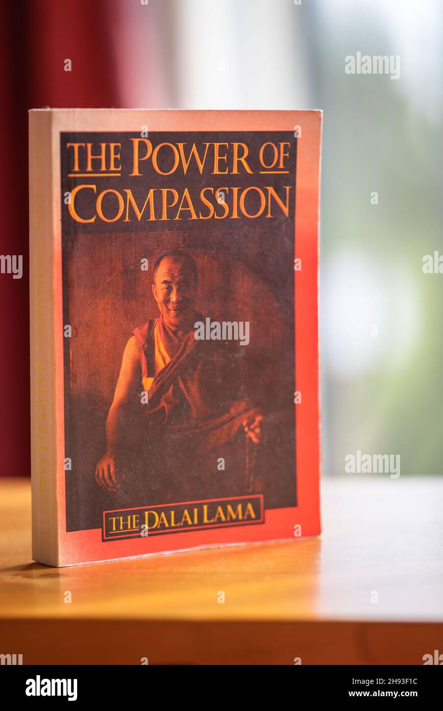 An old English copy of the 'Power of Compassion' book by the Dalai Lama Stock Photo