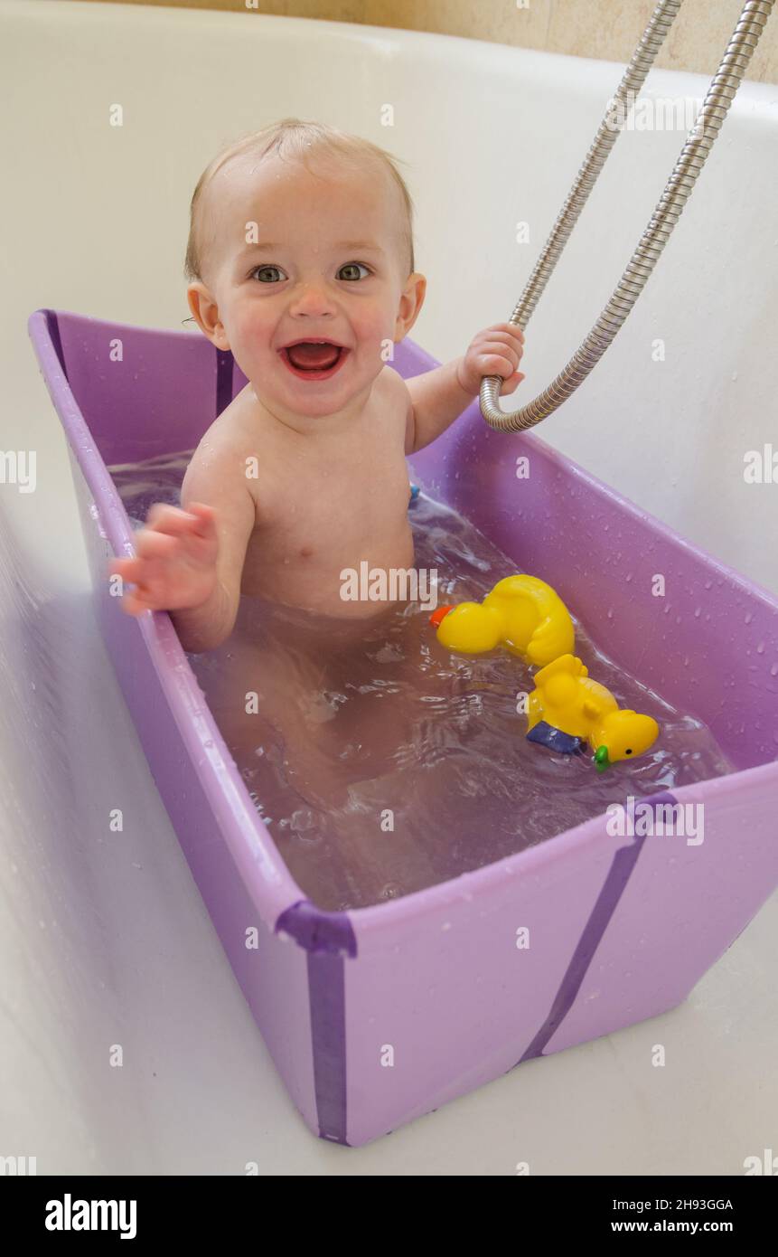 A baby girl (ca. 11 months old) has a bath at home Stock Photo Alamy