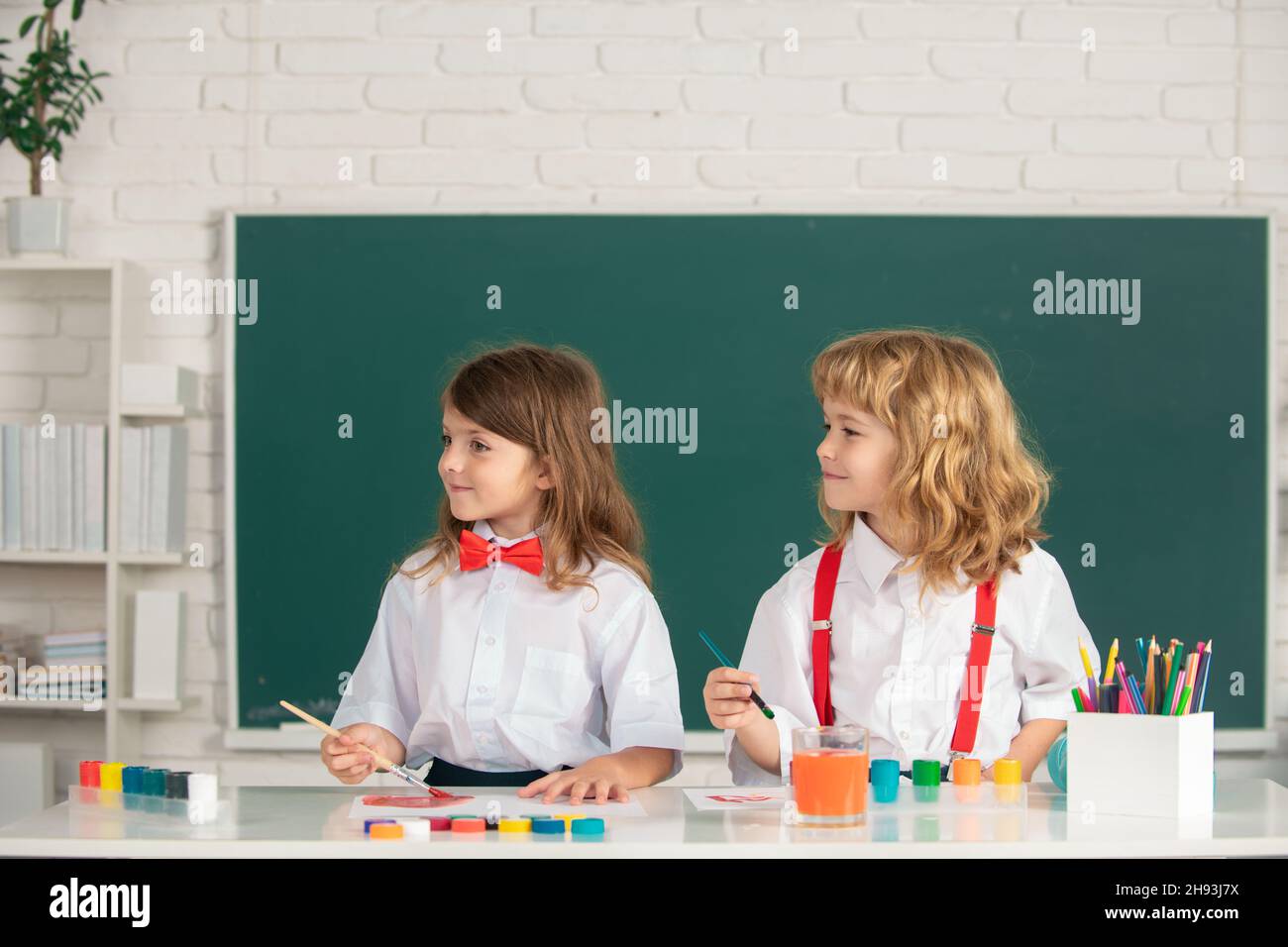 Kids creative education. School children drawing a colorful pictures ...