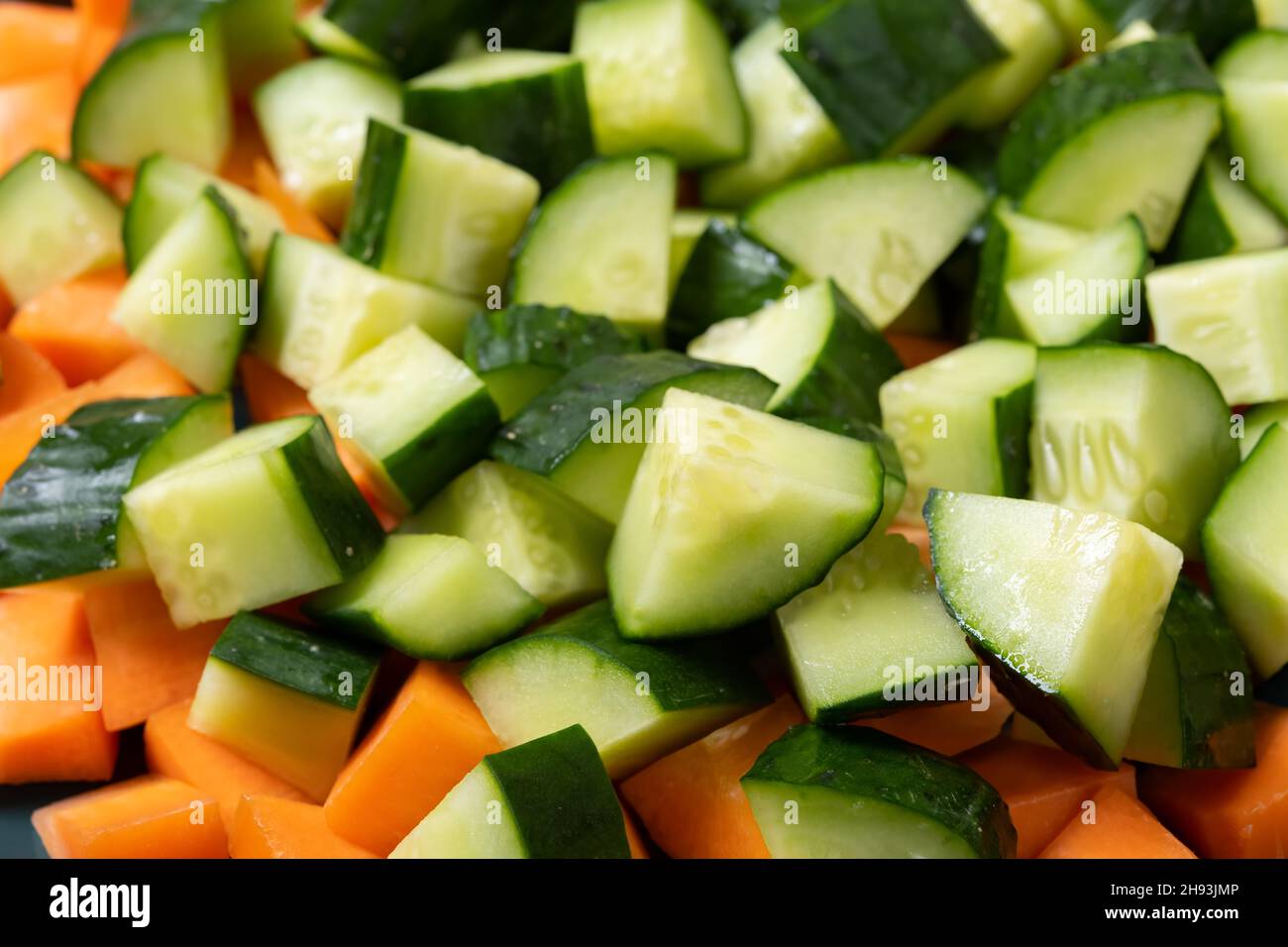 top view small pieces fresh cut cucumber and carrot Stock Photo - Alamy