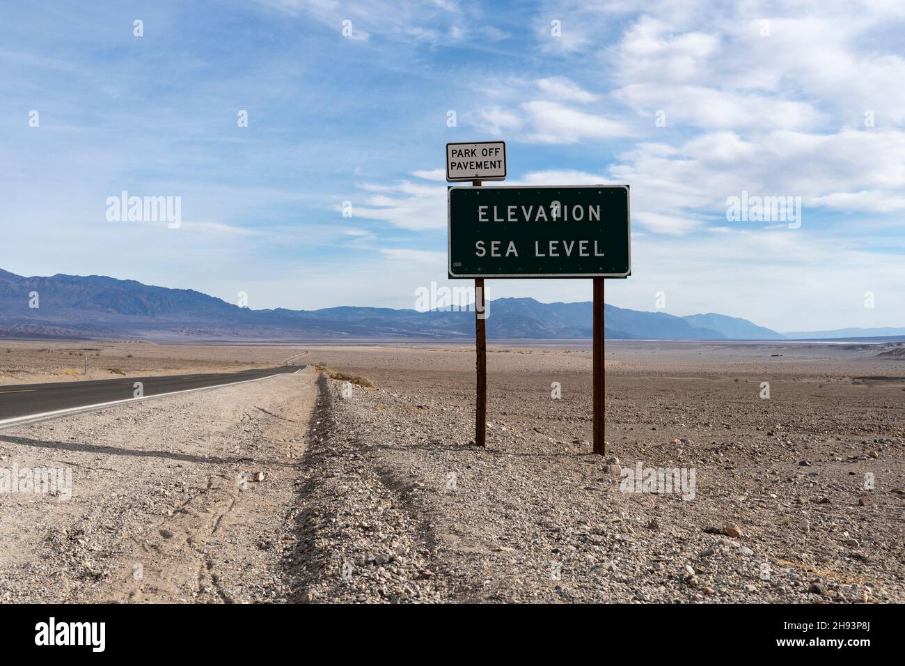 Highway sign depicting sea level in Death Valley, California, USA. Much of the valley floor in Death Valley is below sea level. Stock Photo