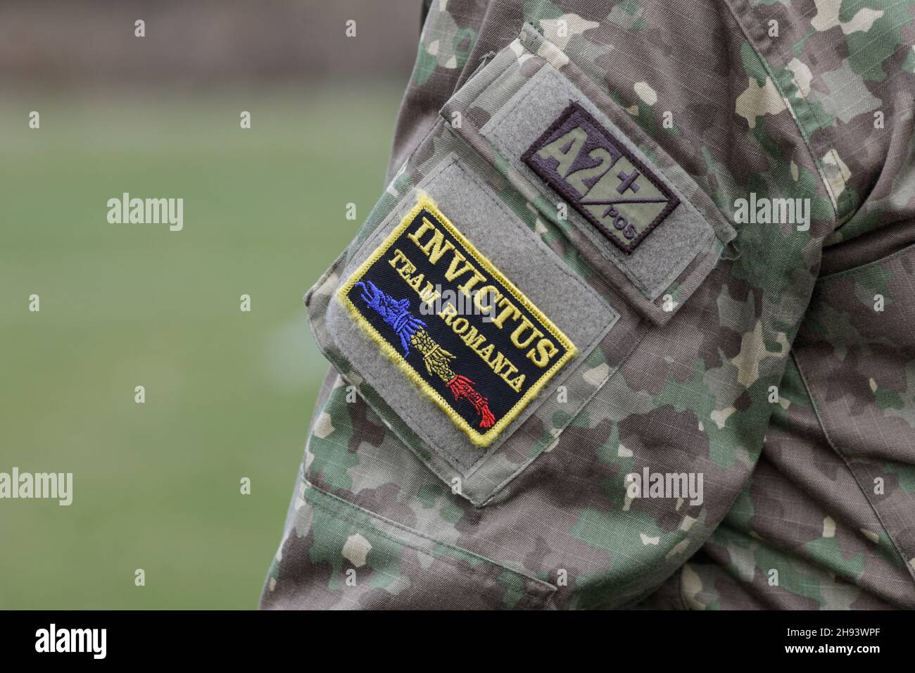 Bucharest, Romania - 3 December, 2021: Details with an Invictus Team Romania badge on the uniform of a Romanian army soldier. The blood type is also m Stock Photo