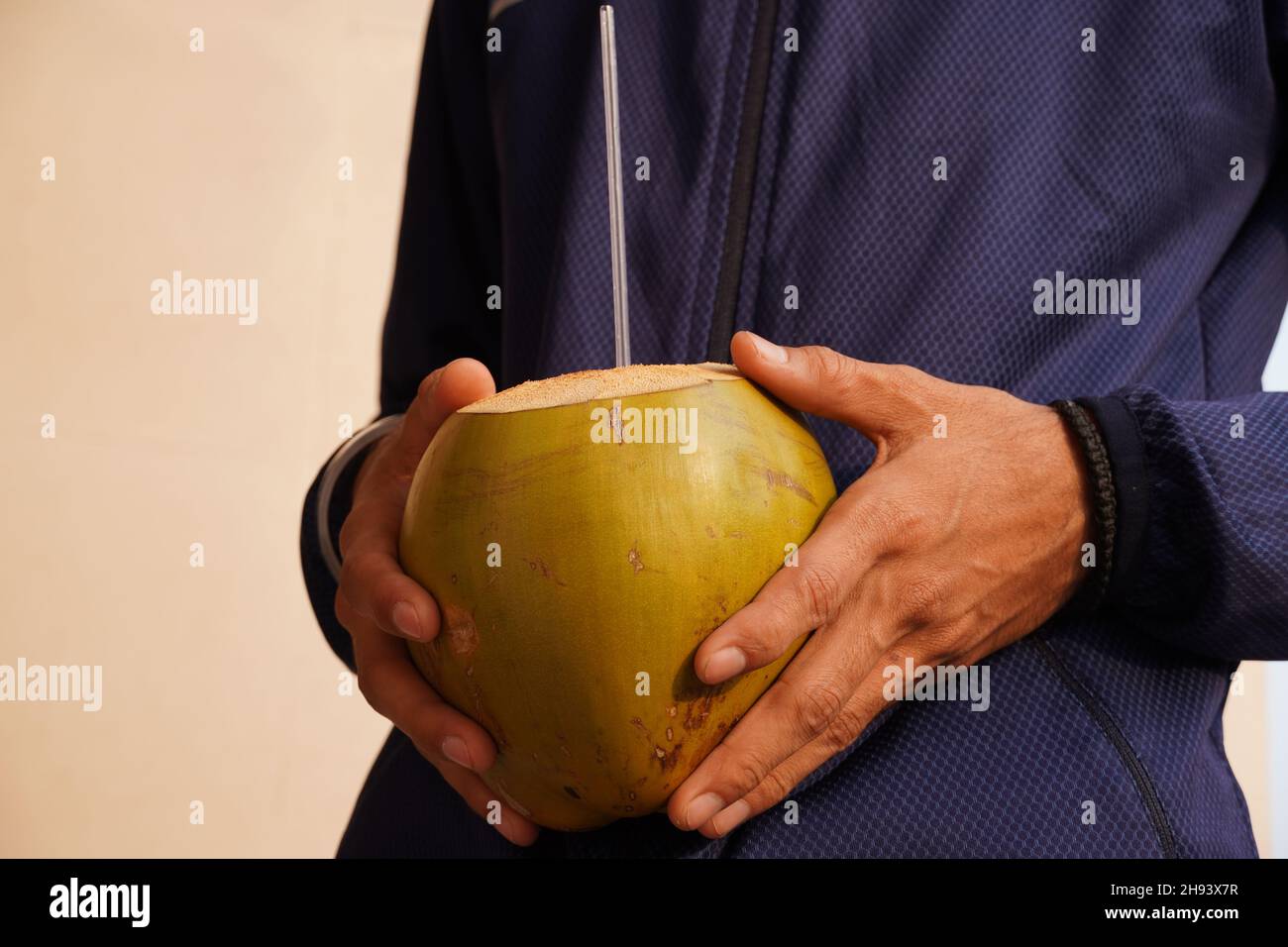dengue coconut water in a patient hand Stock Photo