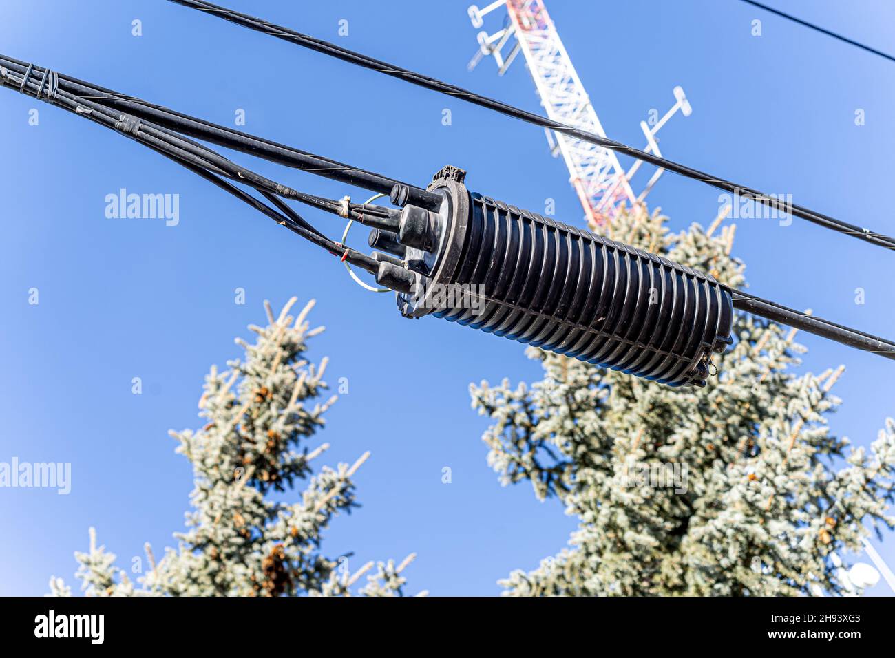 Splice Enclosure on a telephone pole in city Stock Photo